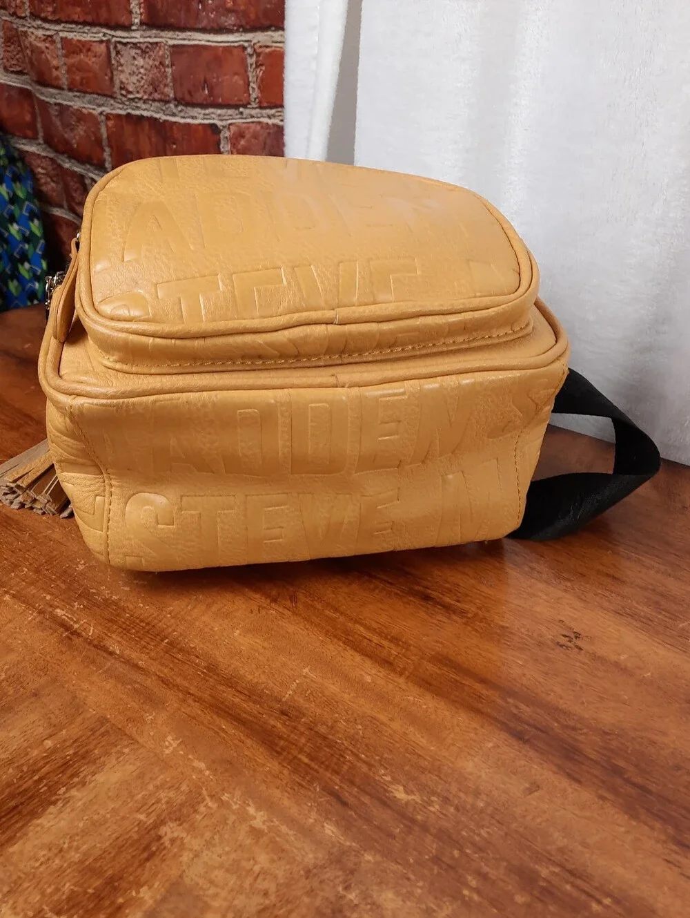 Steve Madden Mustard Mini Tassel Backpack